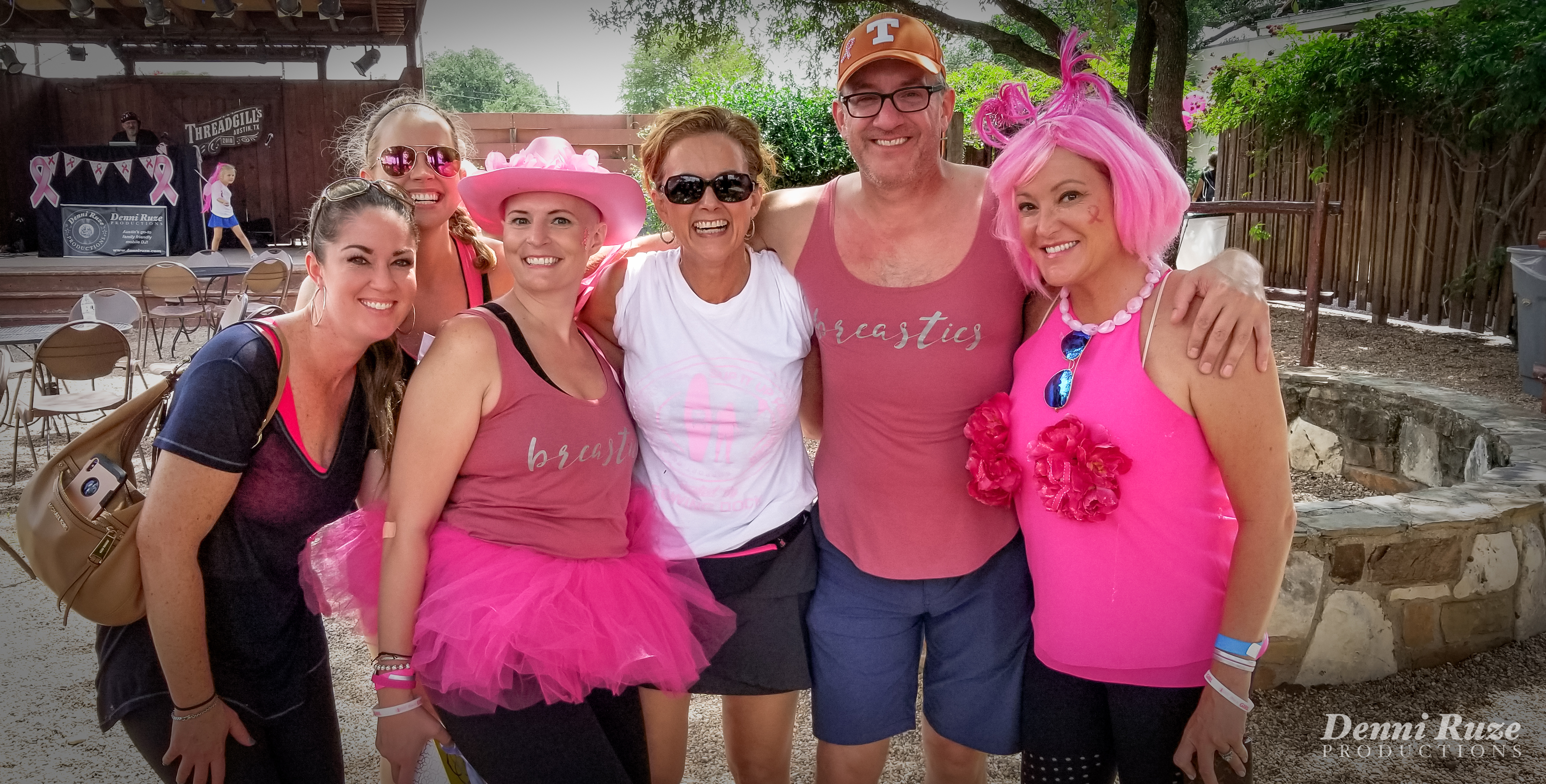 group of sixing smiling participants, wearing mostly pink!